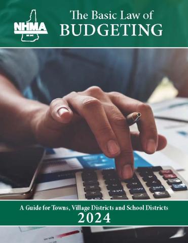 picture of a  hand hovering over a calculator with Basic Law of Budgeting in white on a green background